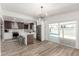 Open-concept kitchen with modern stainless-steel appliances, breakfast bar seating and convenient access to the pool at 1920 N Cavalier Dr, Tempe, AZ 85288