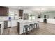 Stylish kitchen boasts a large island with seating, stainless steel appliances, and ample counter space at 1920 N Cavalier Dr, Tempe, AZ 85288