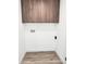 Bright laundry area with modern flooring, white walls, and convenient hookups at 1920 N Cavalier Dr, Tempe, AZ 85288