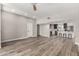Inviting living area with wood-look flooring seamlessly flowing into the kitchen and dining spaces at 1920 N Cavalier Dr, Tempe, AZ 85288