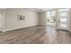 Spacious living room featuring modern flooring, large window, and neutral wall color at 1920 N Cavalier Dr, Tempe, AZ 85288