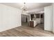 Open-concept living and kitchen area with modern flooring and stylish light fixture at 1920 N Cavalier Dr, Tempe, AZ 85288