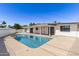 Sparkling blue pool and patio area surrounded by white fencing in a well-maintained backyard at 1920 N Cavalier Dr, Tempe, AZ 85288