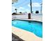 Sparkling private pool with surrounding deck and lush landscaping at 1920 N Cavalier Dr, Tempe, AZ 85288