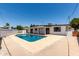 Inviting backyard oasis featuring a sparkling pool and spacious patio, perfect for outdoor entertaining at 1920 N Cavalier Dr, Tempe, AZ 85288