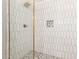 Elegant walk-in shower with sleek tile and gold fixtures at 1920 N Cavalier Dr, Tempe, AZ 85288