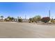 Charming single-story home with desert landscaping, complemented by colorful flowering bushes at 1920 N Cavalier Dr, Tempe, AZ 85288
