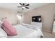 Comfortable primary bedroom featuring a ceiling fan and view of the bathroom at 19700 N 76Th St # 1151, Scottsdale, AZ 85255