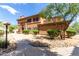 Charming two-story home featuring stone accents, a tiled roof, and well-maintained landscaping at 19700 N 76Th St # 1151, Scottsdale, AZ 85255