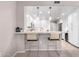 Kitchen bar seating with a view of the modern and stylish kitchen and stainless steel appliances at 19700 N 76Th St # 1151, Scottsdale, AZ 85255