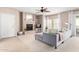 Cozy living room featuring a fireplace, ceiling fan, and sliding glass doors to the patio at 19700 N 76Th St # 1151, Scottsdale, AZ 85255