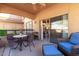 Outdoor covered patio with seating area and access to the living area at 19700 N 76Th St # 1151, Scottsdale, AZ 85255