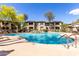 Beautiful community pool featuring a waterfall and lush landscaping, creating a serene atmosphere at 19700 N 76Th St # 1151, Scottsdale, AZ 85255