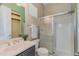 Bathroom showcasing a walk-in shower, neutral paint, and a green-accented alcove at 20233 E Maya Rd, Queen Creek, AZ 85142