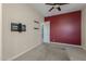 Bedroom featuring neutral paint, ceiling fan, and a painted accent wall at 20233 E Maya Rd, Queen Creek, AZ 85142