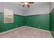 Cozy bedroom with neutral carpet, ceiling fan, and window to let natural light in at 20233 E Maya Rd, Queen Creek, AZ 85142