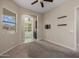 Bedroom featuring neutral paint, ceiling fan, and window with bright, natural light at 20233 E Maya Rd, Queen Creek, AZ 85142
