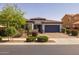Charming single-story home with a well-maintained front yard and inviting curb appeal at 20233 E Maya Rd, Queen Creek, AZ 85142