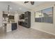 Kitchen featuring dark cabinets, granite countertops, an island, and stainless steel appliances at 20233 E Maya Rd, Queen Creek, AZ 85142