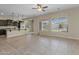 Spacious kitchen features dark wood cabinetry, granite countertops, and stainless steel appliances at 20233 E Maya Rd, Queen Creek, AZ 85142