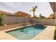 Backyard featuring a refreshing pool and low-maintenance artificial turf at 20233 E Maya Rd, Queen Creek, AZ 85142