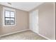 Neutral bedroom with a large window for ample natural light and a closet with sliding doors at 2090 S Dorsey Ln # 1037, Tempe, AZ 85282