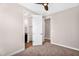 View of bedroom with doorways leading to closet and bathroom; neutral walls and carpet floor at 2090 S Dorsey Ln # 1037, Tempe, AZ 85282