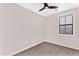 Bedroom featuring neutral walls, carpet flooring, a ceiling fan, and a large window at 2090 S Dorsey Ln # 1037, Tempe, AZ 85282
