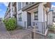 Charming front entrance with a blue door, gray trim, and a well-maintained walkway and landscaping at 2090 S Dorsey Ln # 1037, Tempe, AZ 85282