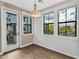 Bright room featuring wood-look flooring, ample natural light from multiple large windows, and modern lighting at 2090 S Dorsey Ln # 1037, Tempe, AZ 85282