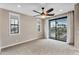 This main bedroom features large windows and a patio door for ample sunlight, plus a ceiling fan at 2090 S Dorsey Ln # 1037, Tempe, AZ 85282