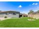 This backyard features artificial turf and a serene space for outdoor enjoyment at 2325 E Delgado St, Phoenix, AZ 85022