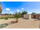 Backyard featuring mature landscaping and a storage shed at 2325 E Delgado St, Phoenix, AZ 85022