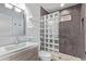 Updated bathroom featuring a modern vanity and glass block shower at 2325 E Delgado St, Phoenix, AZ 85022