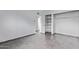 An empty room with tiled floors and open closet with shelving and hanging space at 2325 E Delgado St, Phoenix, AZ 85022