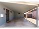 Covered carport area with direct access to the home's entrance, offering convenience and protection from the elements at 2325 E Delgado St, Phoenix, AZ 85022
