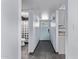 Hallway with tile floor leading to the bath and front door at 2325 E Delgado St, Phoenix, AZ 85022