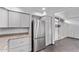 Close up of the stainless steel refrigerator and counter space in the kitchen at 2325 E Delgado St, Phoenix, AZ 85022