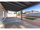 Spacious backyard featuring a covered patio, low-maintenance gravel, and artificial turf at 2345 E Isabella Ave, Mesa, AZ 85204