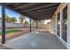Covered patio looking out to large backyard with gravel and square of artificial turf at 2345 E Isabella Ave, Mesa, AZ 85204