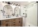 Modern bathroom boasts dual sinks, stylish mirrors, and a sleek glass shower at 2345 E Isabella Ave, Mesa, AZ 85204