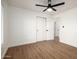 Bedroom features wood-look flooring, and access to the Primary bath at 2345 E Isabella Ave, Mesa, AZ 85204