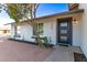 Charming home exterior featuring a modern front door, gravel landscaping, and well-maintained greenery at 2345 E Isabella Ave, Mesa, AZ 85204