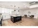 Modern kitchen features a center island with seating and ample counter space for entertaining at 2345 E Isabella Ave, Mesa, AZ 85204