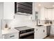 Modern kitchen with white subway tile backsplash and stainless steel appliances at 2345 E Isabella Ave, Mesa, AZ 85204