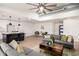 Spacious living room featuring an open layout to the kitchen and modern decor at 2345 E Isabella Ave, Mesa, AZ 85204