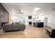 Spacious open-concept living area with modern kitchen and cozy living room flowing seamlessly together at 2345 E Isabella Ave, Mesa, AZ 85204