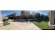 Expansive backyard featuring artificial turf, a cozy seating area, and vibrant trees for added ambiance at 23497 S 212Th St, Queen Creek, AZ 85142
