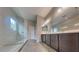 Modern bathroom featuring a glass-enclosed shower, double vanity, and tile floors at 23497 S 212Th St, Queen Creek, AZ 85142