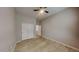 This cozy bedroom boasts ample natural light, a ceiling fan, and a spacious closet with sliding doors at 23497 S 212Th St, Queen Creek, AZ 85142